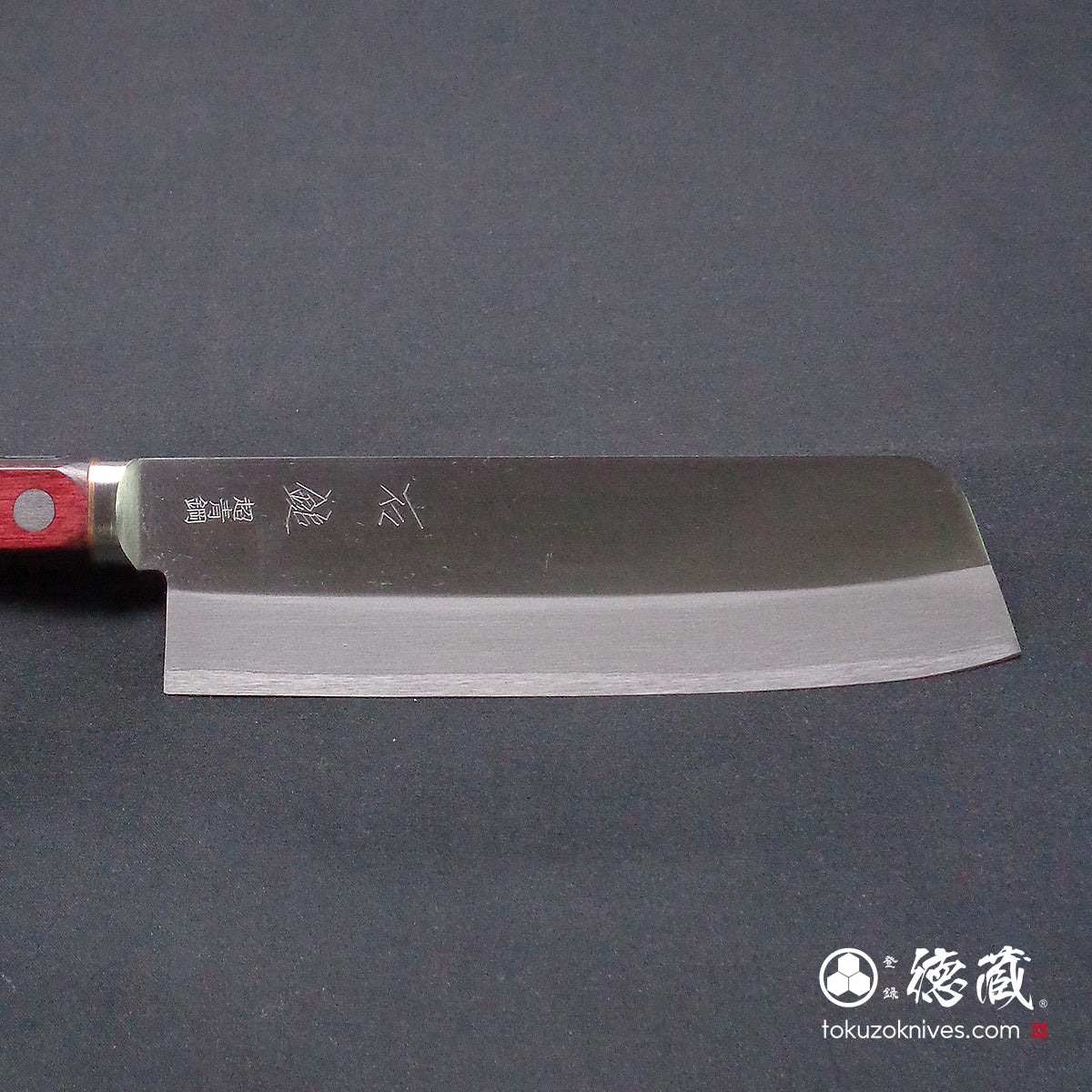 Blue S vegetable knife with red and black handle