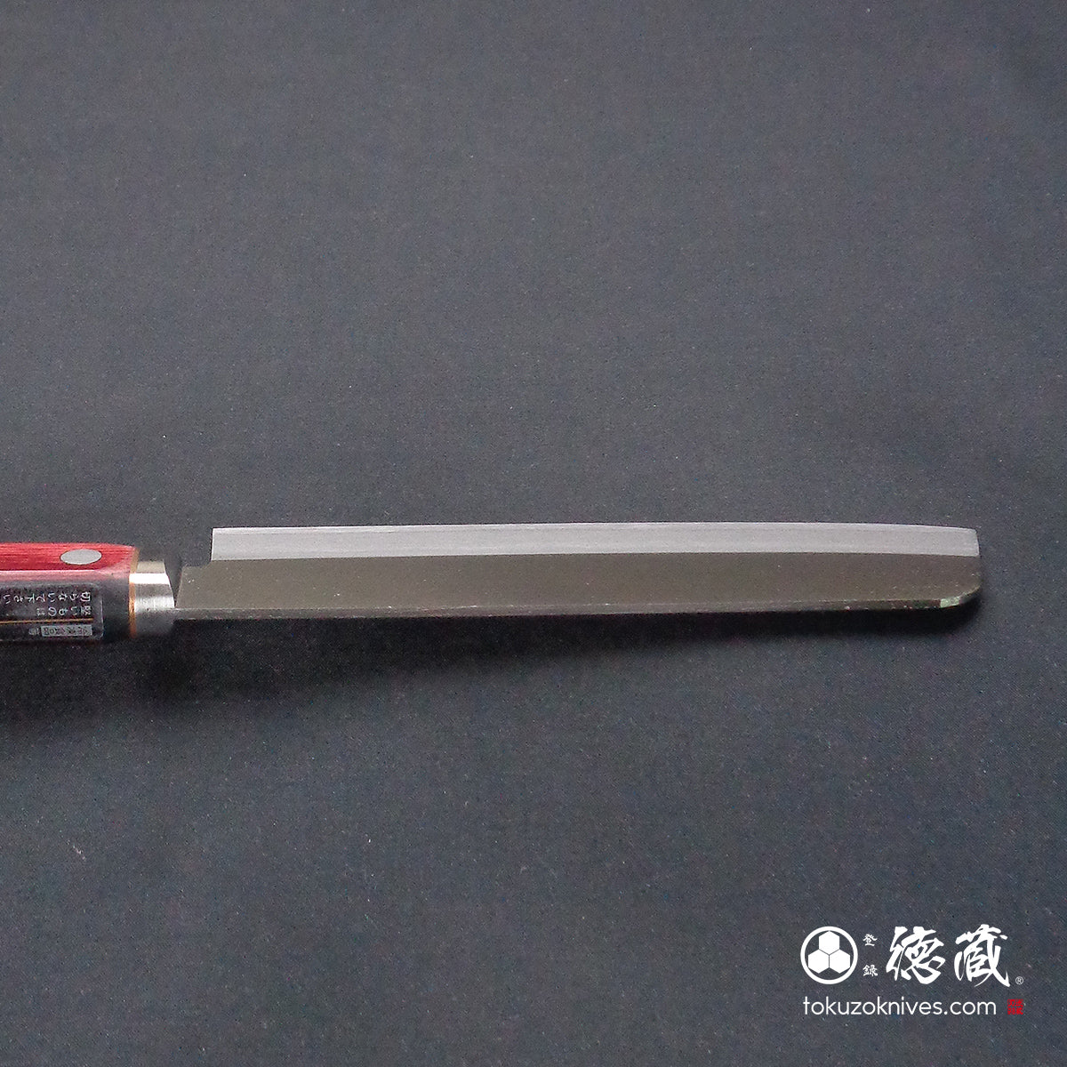 Blue S vegetable knife with red and black handle