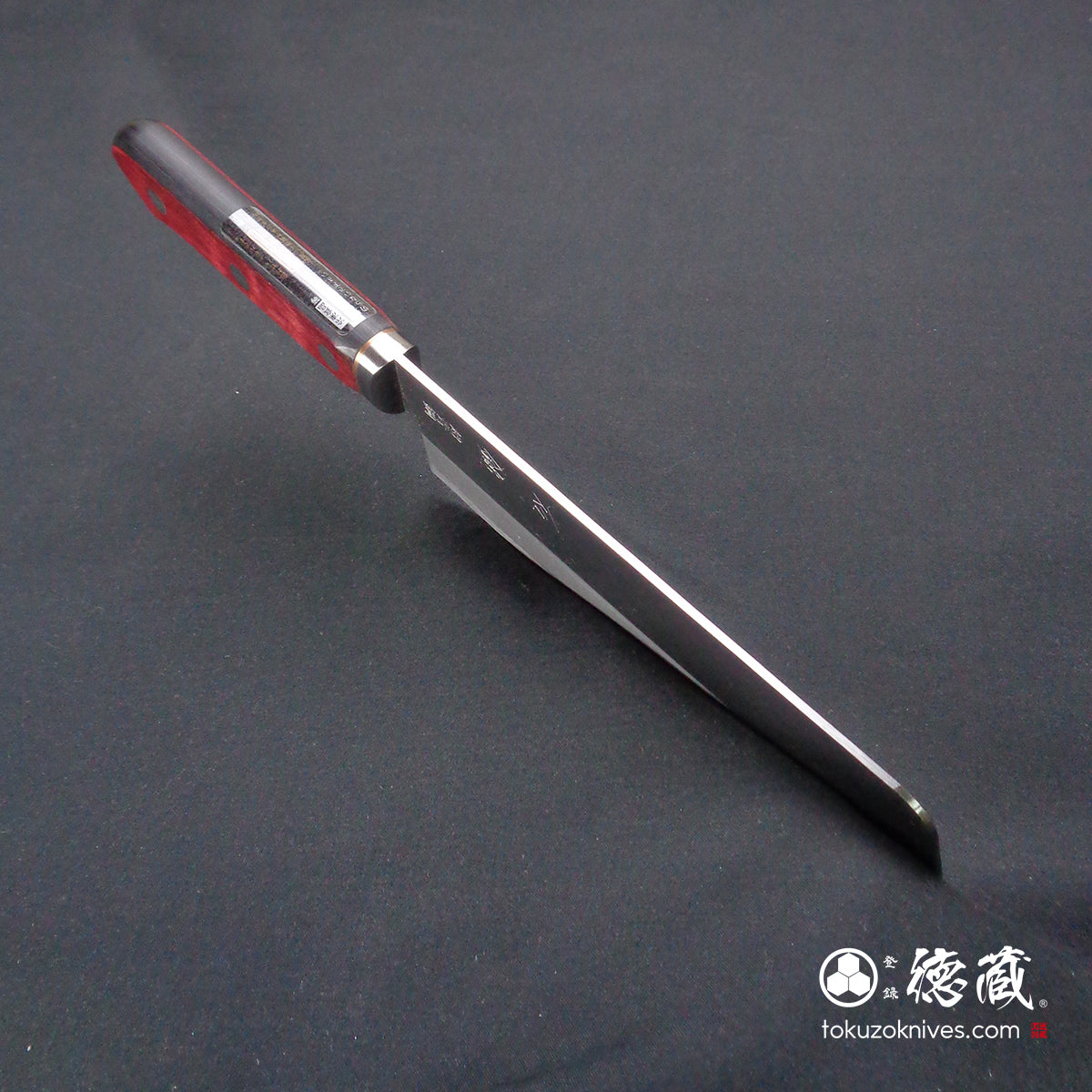 Blue S vegetable knife with red and black handle