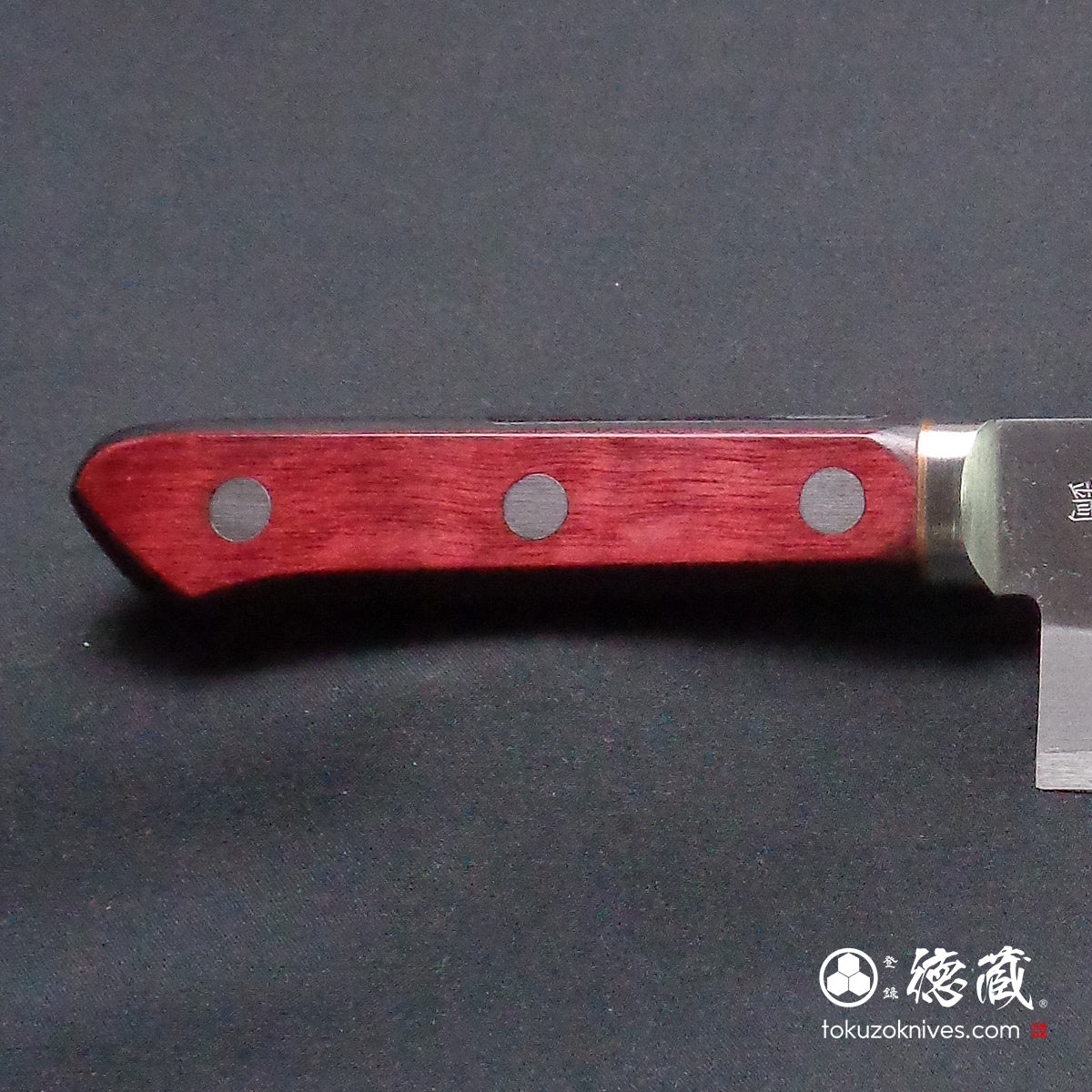 Blue S vegetable knife with red and black handle